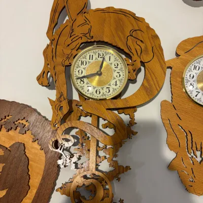 Sale Photo Thumbnail #157: Wooden hunting picture; working wooden dragon & cat wall clocks