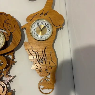 Sale Photo Thumbnail #158: Wooden hunting picture; working wooden dragon & cat wall clocks