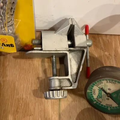 Sale Photo Thumbnail #303: 3 regulators, gear shift knob, small vise