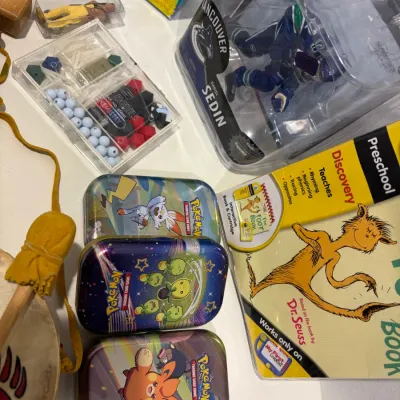 Sale Photo Thumbnail #321: Misc. toy lot, Pokémon tins are empty