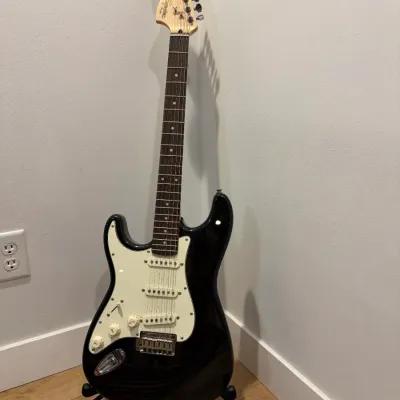 Sale Photo Thumbnail #25: Early 2000's, lefty guitar, rosewood fret boards, skunk stripe neck, works as should