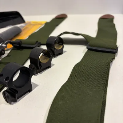 Sale Photo Thumbnail #289: Putter return, leather gun holster, suspenders, knife, sight mounts, hand radio, fishing reel