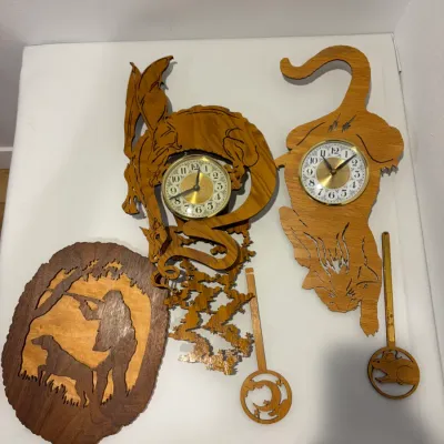 Sale Photo Thumbnail #155: Wooden hunting picture; working wooden dragon & cat wall clocks