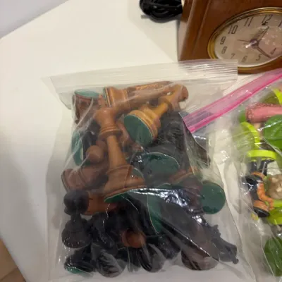 Sale Photo Thumbnail #296: Metal men figures, wooden clock, bookend, 1 set of Shrek chess pieces, 1 set of wooden chess pieces