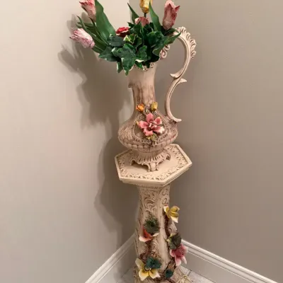 Ornate, vintage ceramic pitcher vase and matching pedestal stand adorned with dimensional sculptures