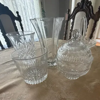 Collection features clear glass and crystal decorative pieces