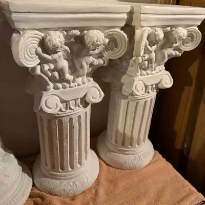 Pair of white decorative pedestals and one statue