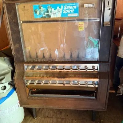 Classic vintage mechanical cigarette vending machine manufactured by National Vendors