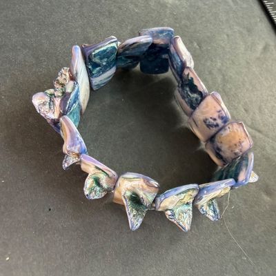 iridescent abalone and mother-of-pearl type multi-color shell stretch bracelet featuring polished, layered rectangular shell tiles with...