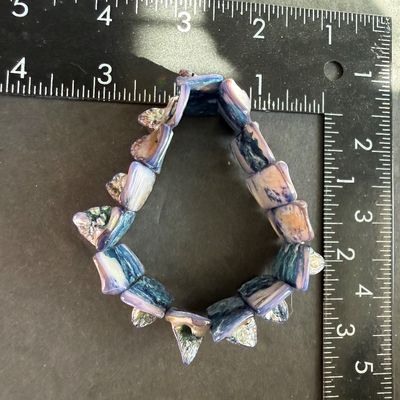 iridescent abalone and mother-of-pearl type multi-color shell stretch bracelet featuring polished, layered rectangular shell tiles with...