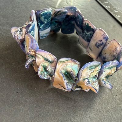 iridescent abalone and mother-of-pearl type multi-color shell stretch bracelet featuring polished, layered rectangular shell tiles with...