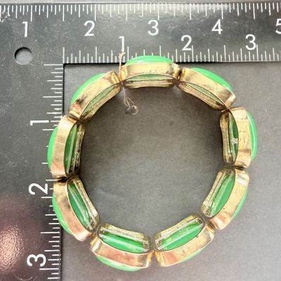 Green and gold tone stretch bracelet