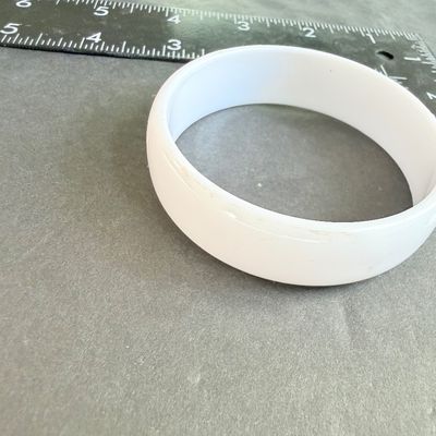 White lucite type bangle bracelet
