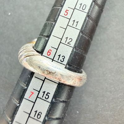 Black stone center type silver tone ring