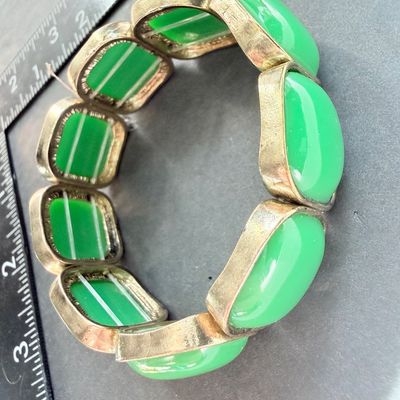 Green and gold tone stretch bracelet