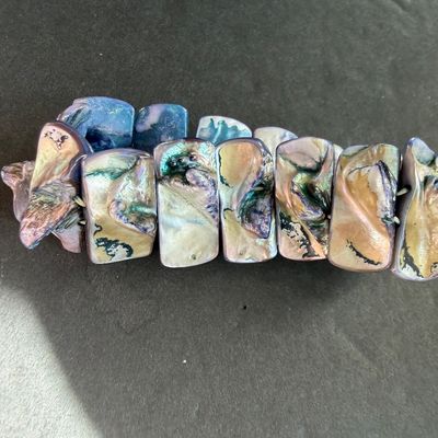 iridescent abalone and mother-of-pearl type multi-color shell stretch bracelet featuring polished, layered rectangular shell tiles with...