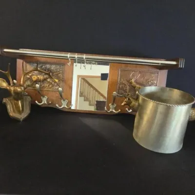5 - Brass Deer Wall Hooks and Ice Bucket Set 
Brass wall-mounted coat rack with deer head and antler accents, a cylindrical brass ice...