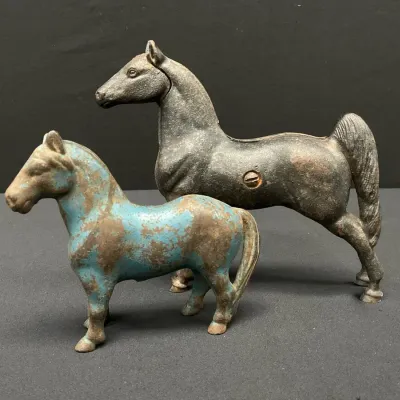 Pair of Cast Metal Recumbent Horses 