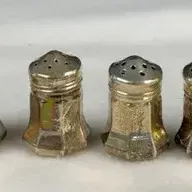 Vintage Cartier sterling silver individual salt and pepper shakers, styled with a small hexagonal or