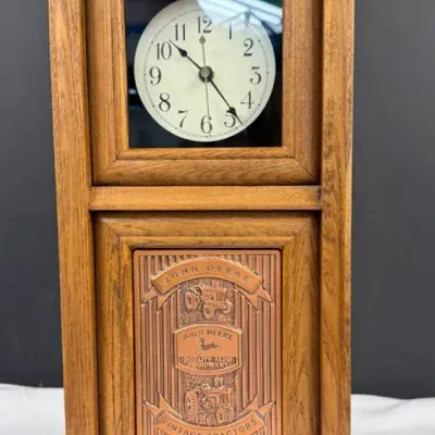 Vintage John Deere "Vintage Tractors" quartz mantel clock featuring a wooden case with a copper-acce