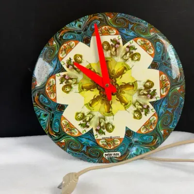 Vintage 1969 Peter Max "Flower Girl" wall clock produced in collaboration with General Electric, fea