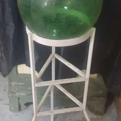 Green Glass Orb In Triangular Metal Plant Stand