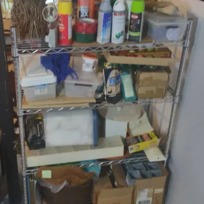 Wire Metal Shelf With Varied Contents.
