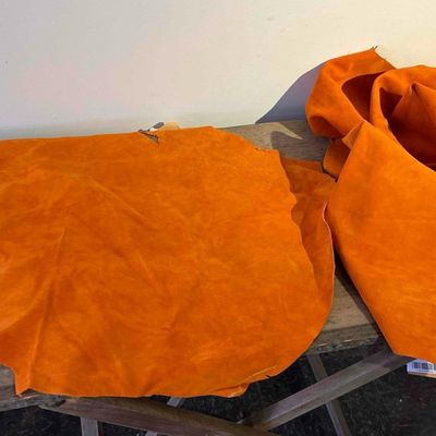 Sale Photo Thumbnail #192: A Pair of Orange Sueded Hog Leather Hides