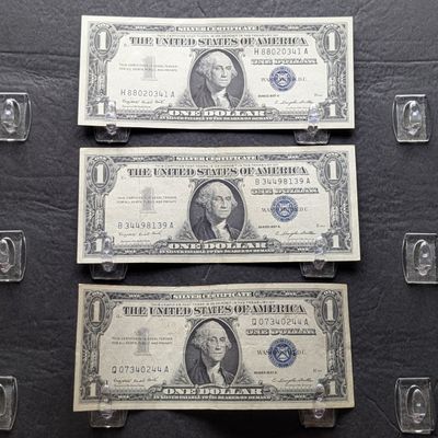 Sale Photo Thumbnail #329: (3) 1957 A U.S. $1 Silver Certificates - Blue Seals