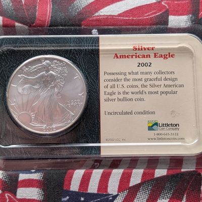 Sale Photo Thumbnail #426: 2002 American Silver Eagle, .999 Fine Silver 1 Troy Oz, Unc. - In Littleton Coin Company Showpak