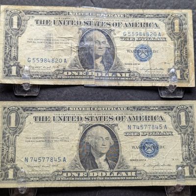 Sale Photo Thumbnail #85: (2) 1957-A US $1 Silver Certificates - Blue Seals, Tape on One