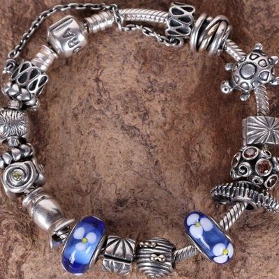 Sale Photo Thumbnail #113: PANDORA STERLING SILVER BRACELET WITH 15 CHARMS