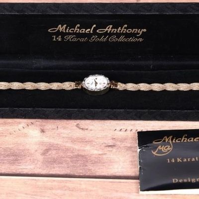 Sale Photo Thumbnail #142: 14K GOLD MICHAEL ANTHONY LADIES WRIST WATCH W/ DIA