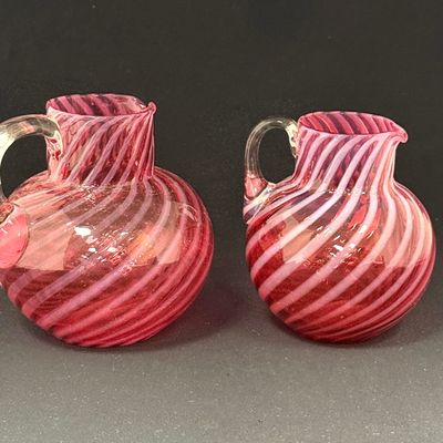 Sale Photo Thumbnail #242: Two Cranberry Strip Pitchers