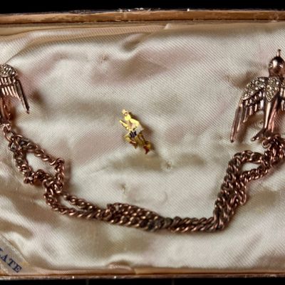Two Mid-Century Figural Costume Jewelry Items Including an Enameled 10 Karat Gold Filled Soldier Pin and a Rhinestone Bird Sweater Guard