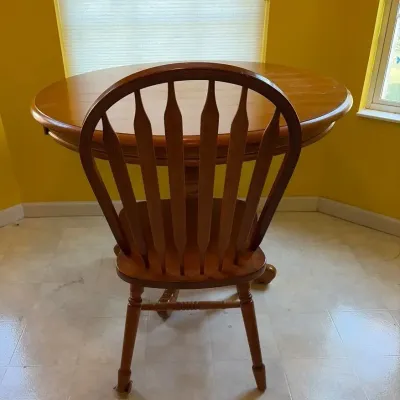 Maple Pedestal Table And An Arrowback Chair