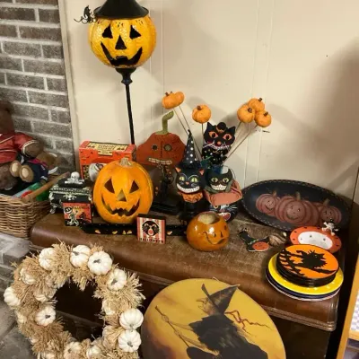 Halloween Decorations Including A Standing Pumpkin, Cats, Wreaths, And More