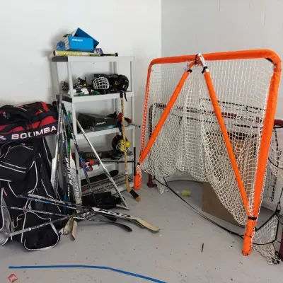 Large Hockey And Sporting Goods Collection Including Storage Shelf