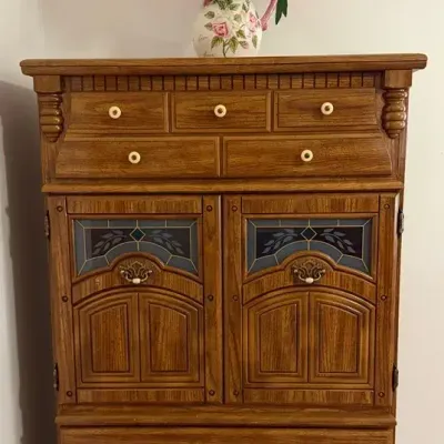 Tall Decorative Storage Chest With Stained Glass-Style Cabinet Doors & Floral Arrangement