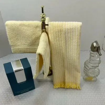 Vintage Bathroom Vanity Collection with Brass Towel Stand, Towels, Glass Atomizer & Estee Powder