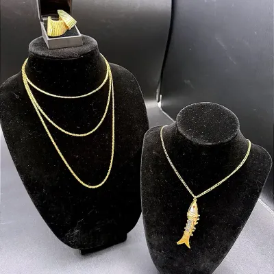 Gold-Toned Lot Featuring Clip-on Earrings, Articulated Fish Necklace And A 27” Chain 