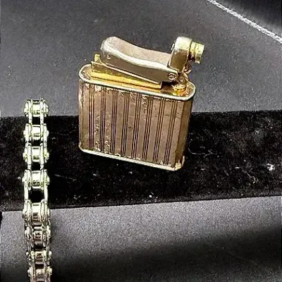 Bicycle Chain Bracelet And Vintage Lighter