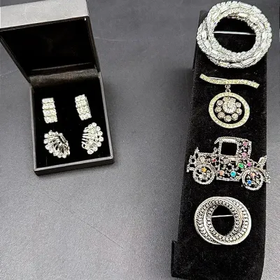 Rhinestone And Silver-Toned Brooches And Clip-On Earrings