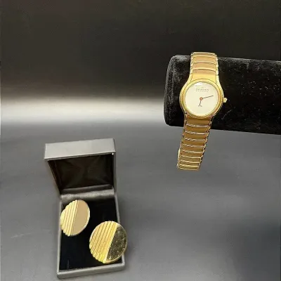 Gold-Toned Lot Featuring A Skagen Denmark Watch And Napier Clip-on Earrings