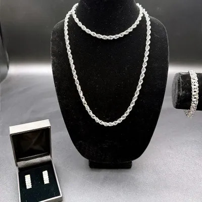 Stylish Sterling Lot Featuring A B.A. Ballou & Co. Charm Bracelet And Monet Rope Chain Necklace