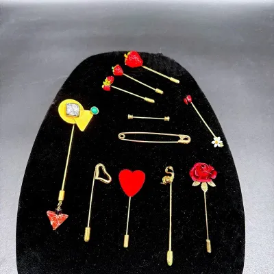 A Collection Of Stick Pins Featuring A Gale Rothstein II Modernist Sculptural Stick Pin
