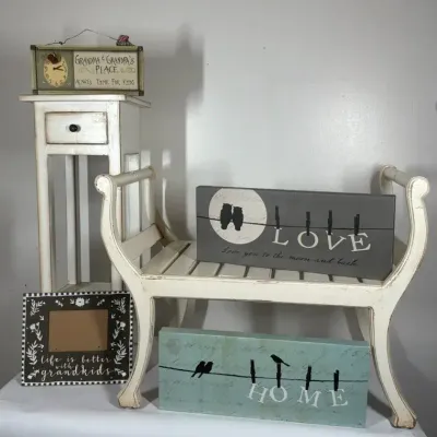 Distressed White Bench with Decorative Signs and Wall Décor