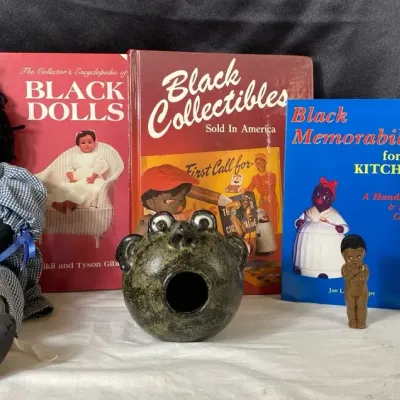 Vintage Black Americana & History Collectibles Lot (Dolls, Pottery, and Reference Books)