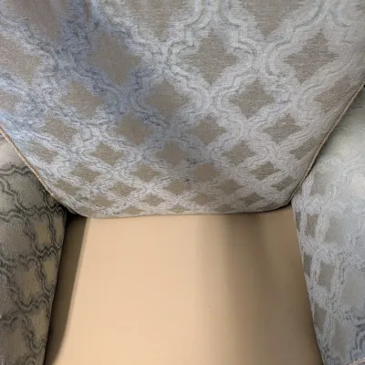 Upholstered Armchair with Trellis Pattern and Pleated Skirt