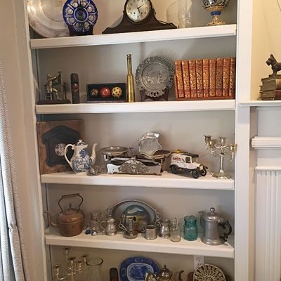 Pewter and silverplate decor, blue and white china, mantel clock